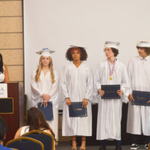 Grads-on-STage-with-Diplomas-MCA-Academy